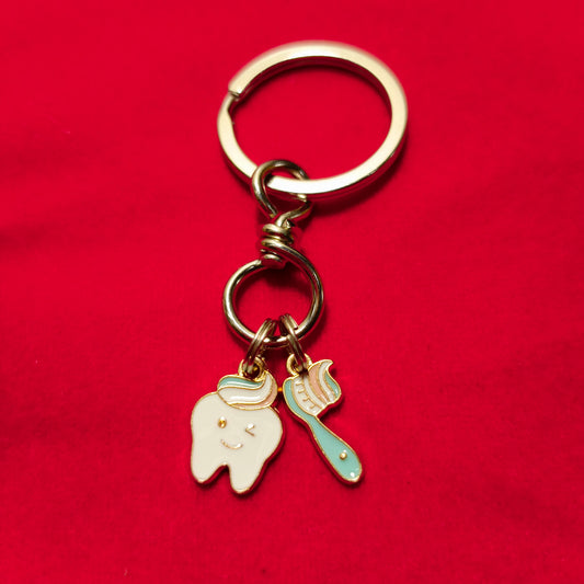 Keychain of tooth & brush enamel filled