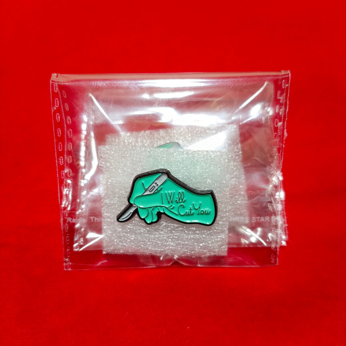Lapel pins brooch of scalpel in hand